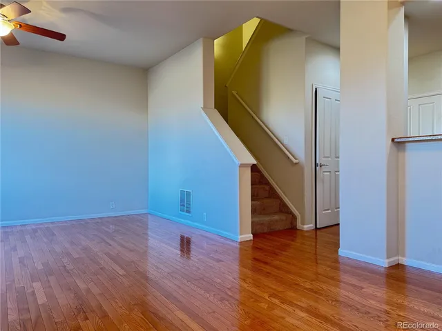 a kitchen with granite countertop a refrigerator stove and sink