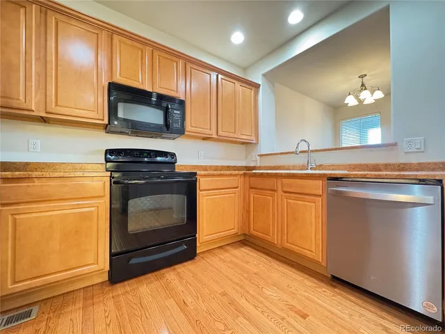 a kitchen with a stove and a sink