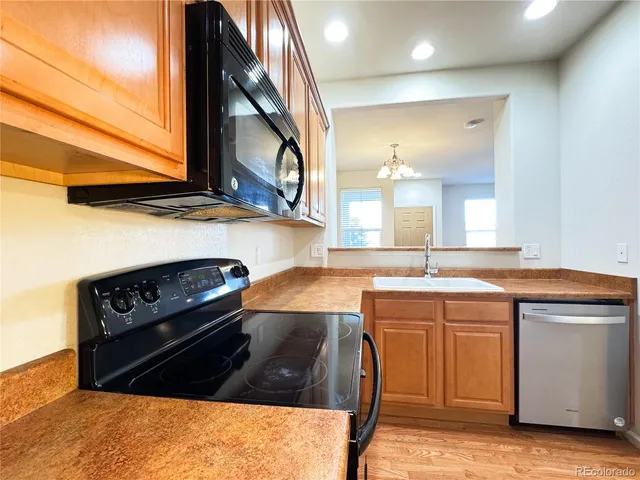 a spacious bedroom with a bed and a window