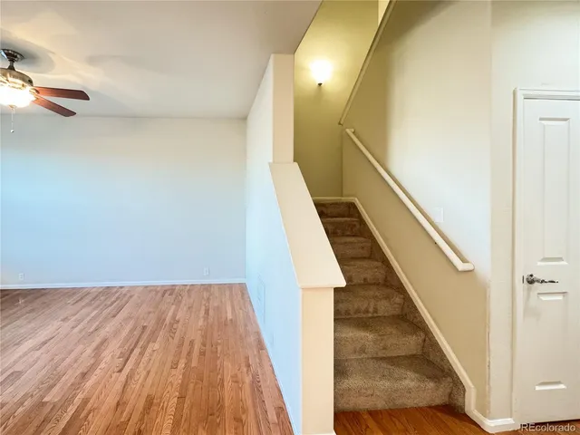 a spacious bathroom with a shower a sink and a mirror