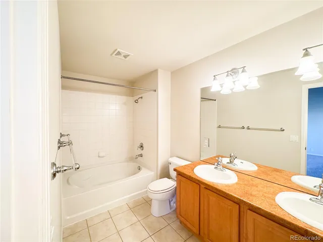 an empty room with a ceiling fan and a window