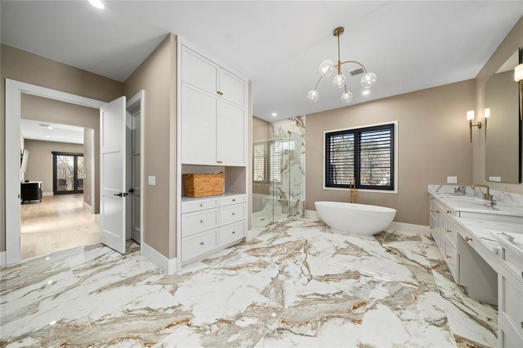 2309 Dinsmore Road Milton, GA 30004 - Photo 30 of 87 a large spacious bathroom with a large tub and sink