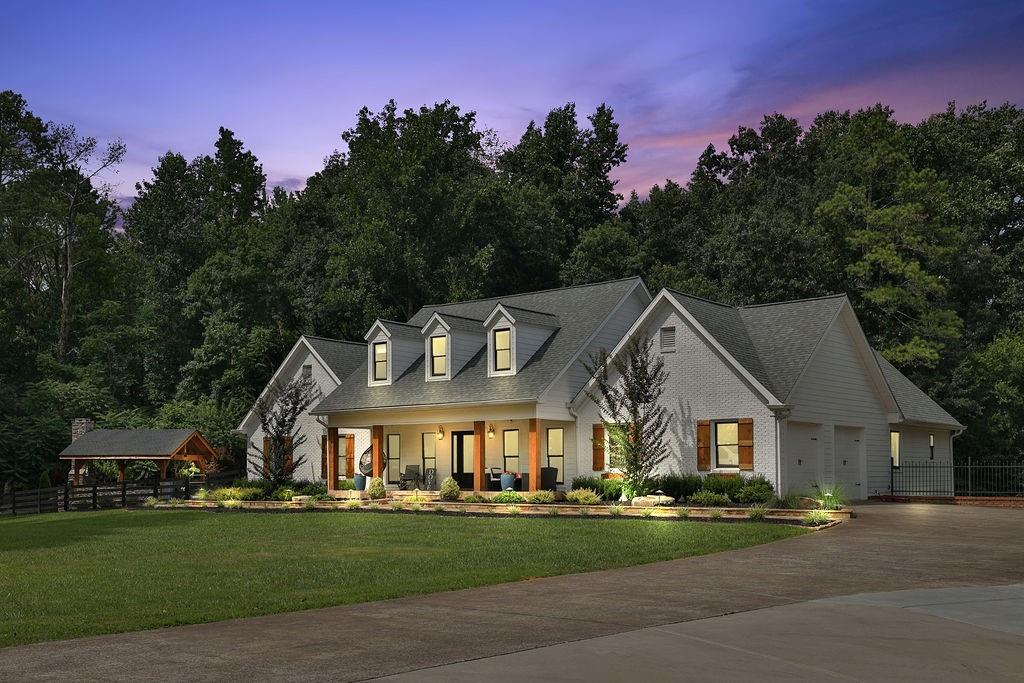 2001 Batesville Road Canton, GA 30115 - Photo 1 of 1 a view of a big house with large trees and plants