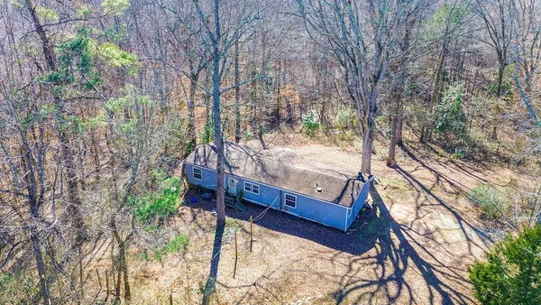 a view of a wooden deck and backyard