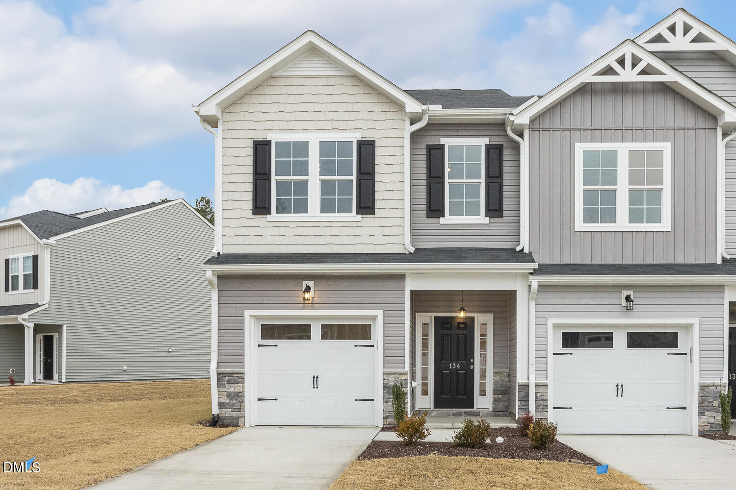 a front view of a house with a garage