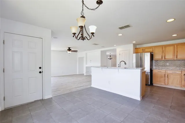 a view of a livingroom with furniture and a ceiling fan