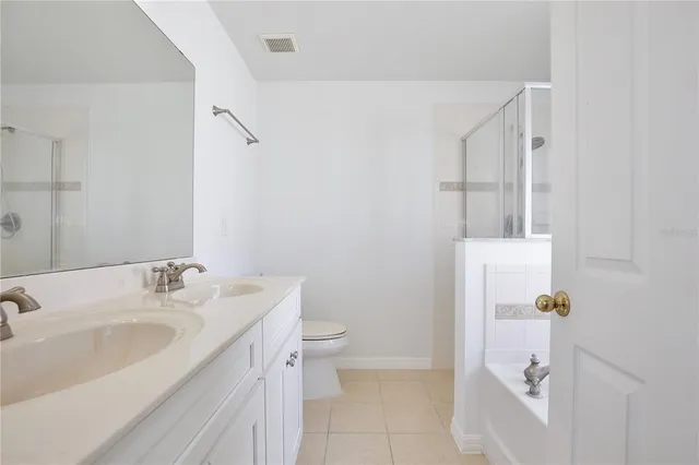 a bathroom with a sink and toilet