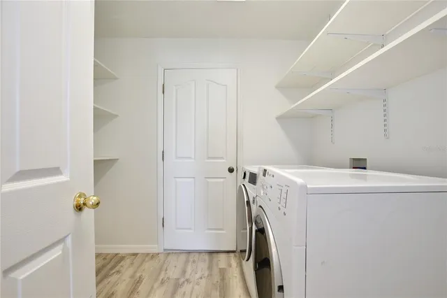 a utility room with dryer and washer