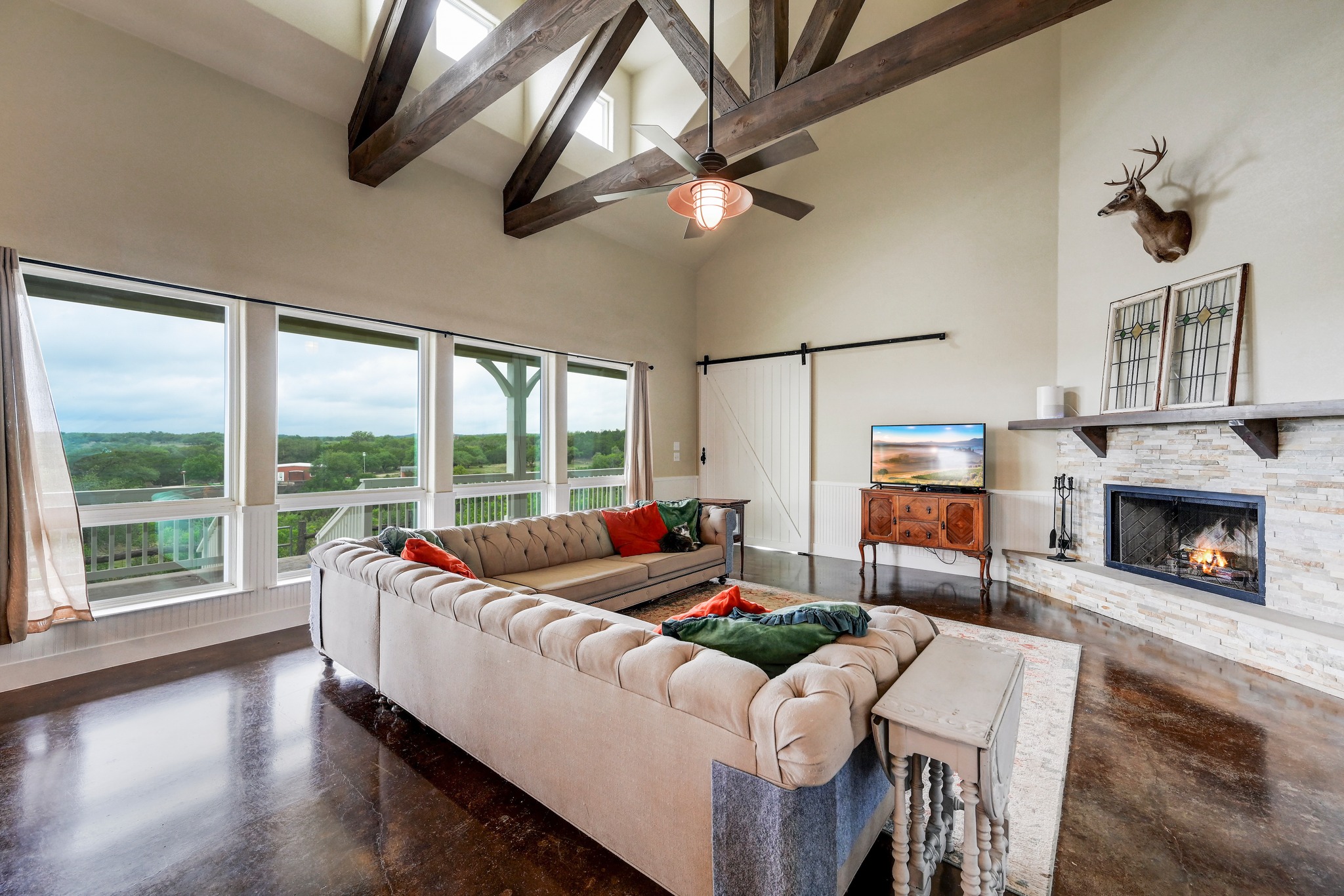 6350 Mt Sharp Road, Unit B Wimberley, TX 78676 - Photo 3 of 34 a living room with furniture fireplace and flat screen tv