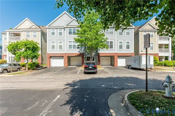 a view of house with outdoor space and parking