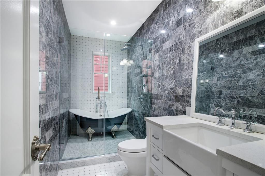 18 Buckingham Road Brooklyn, NY 11226 - Photo 12 of 15 a bathroom with a sink toilet and a mirror