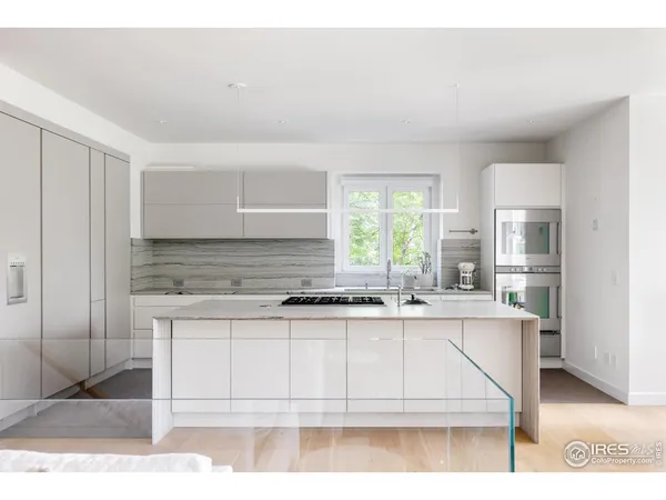 a kitchen with stainless steel appliances granite countertop a sink and cabinets