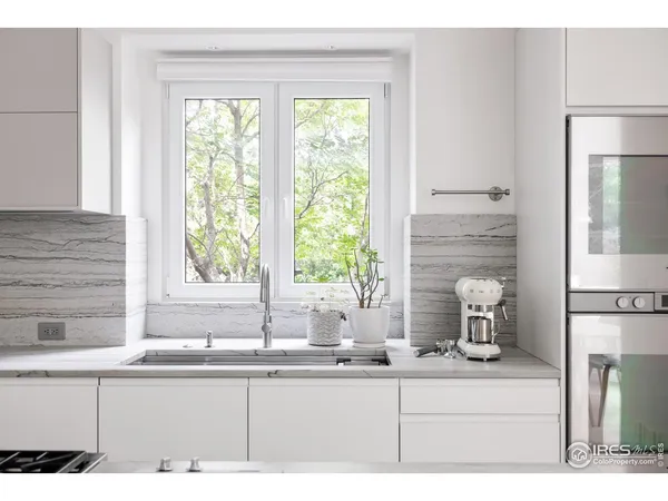a kitchen with a sink and a window