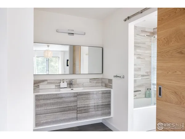 a bathroom with a sink double vanity and a mirror
