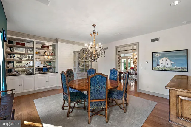 a bathroom with a granite countertop sink a large mirror and a window