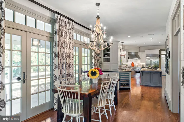 a bathroom with a sink a light fixture and a mirror