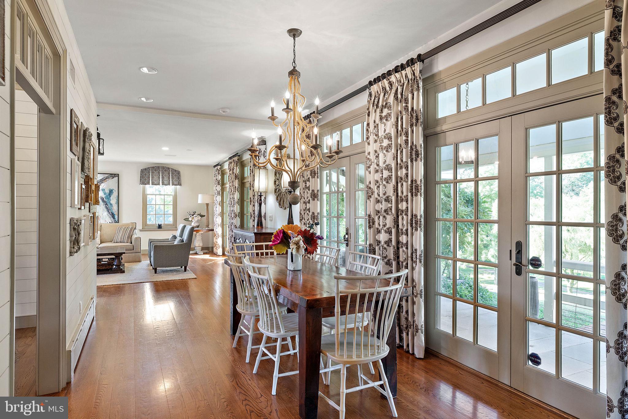 4635 Newark Road Cochranville, PA 19330 - Photo 15 of 113 a view of a dining room with furniture wooden floor and chandelier