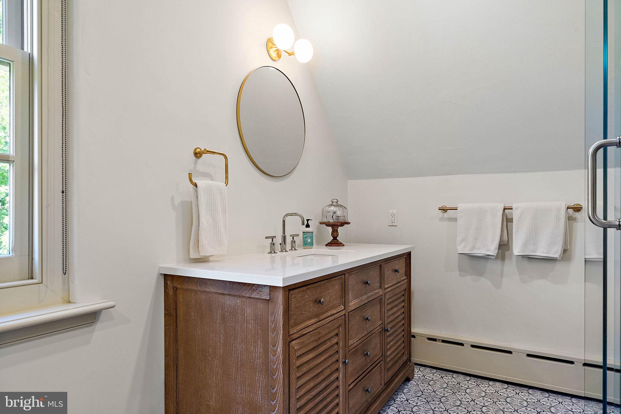 4635 Newark Road Cochranville, PA 19330 - Photo 23 of 113 a bathroom with a sink vanity and a mirror