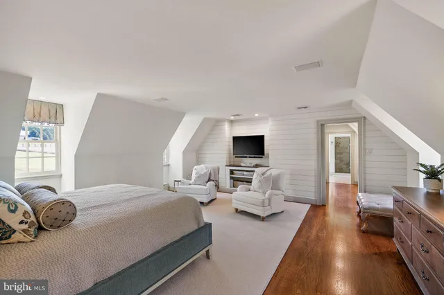 a view of a chairs with table in front of building