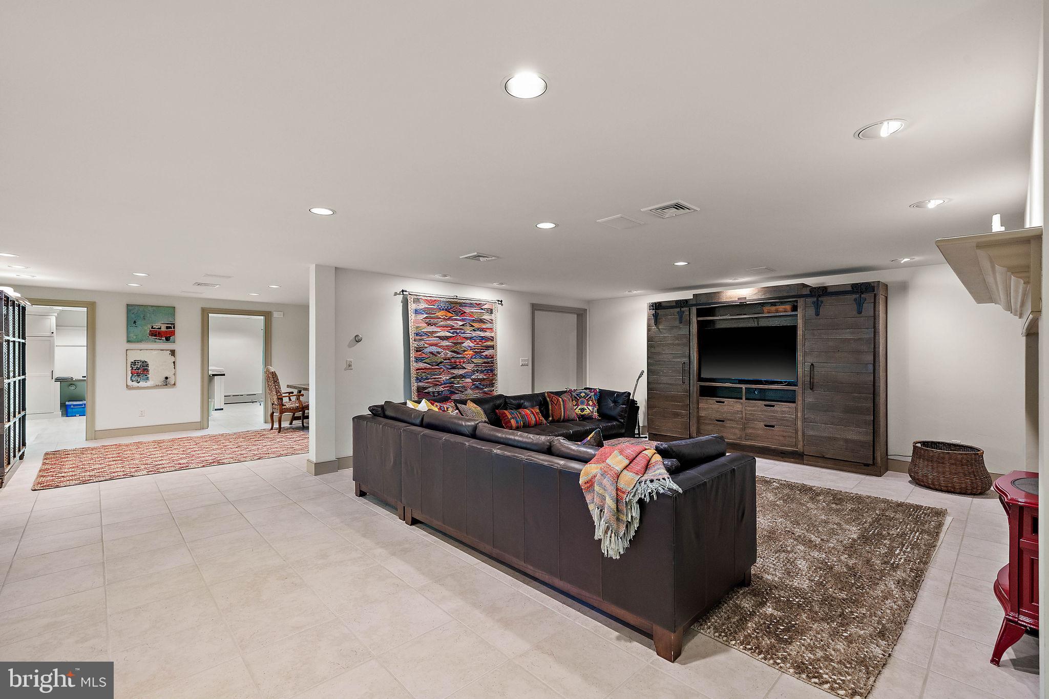 4635 Newark Road Cochranville, PA 19330 - Photo 42 of 113 a living room with furniture and a flat screen tv