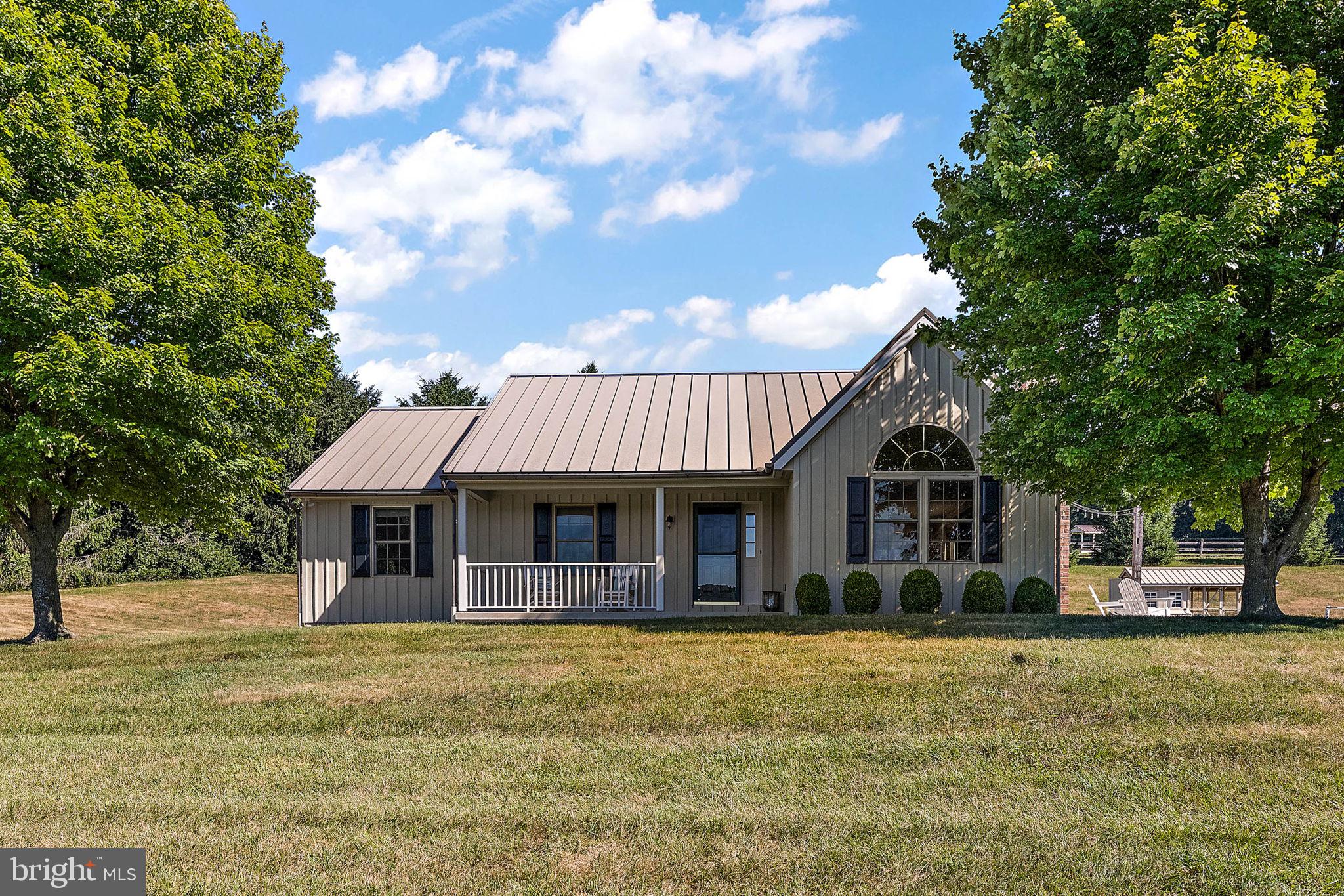 4635 Newark Road Cochranville, PA 19330 - Photo 57 of 113 a front view of a house with a garden