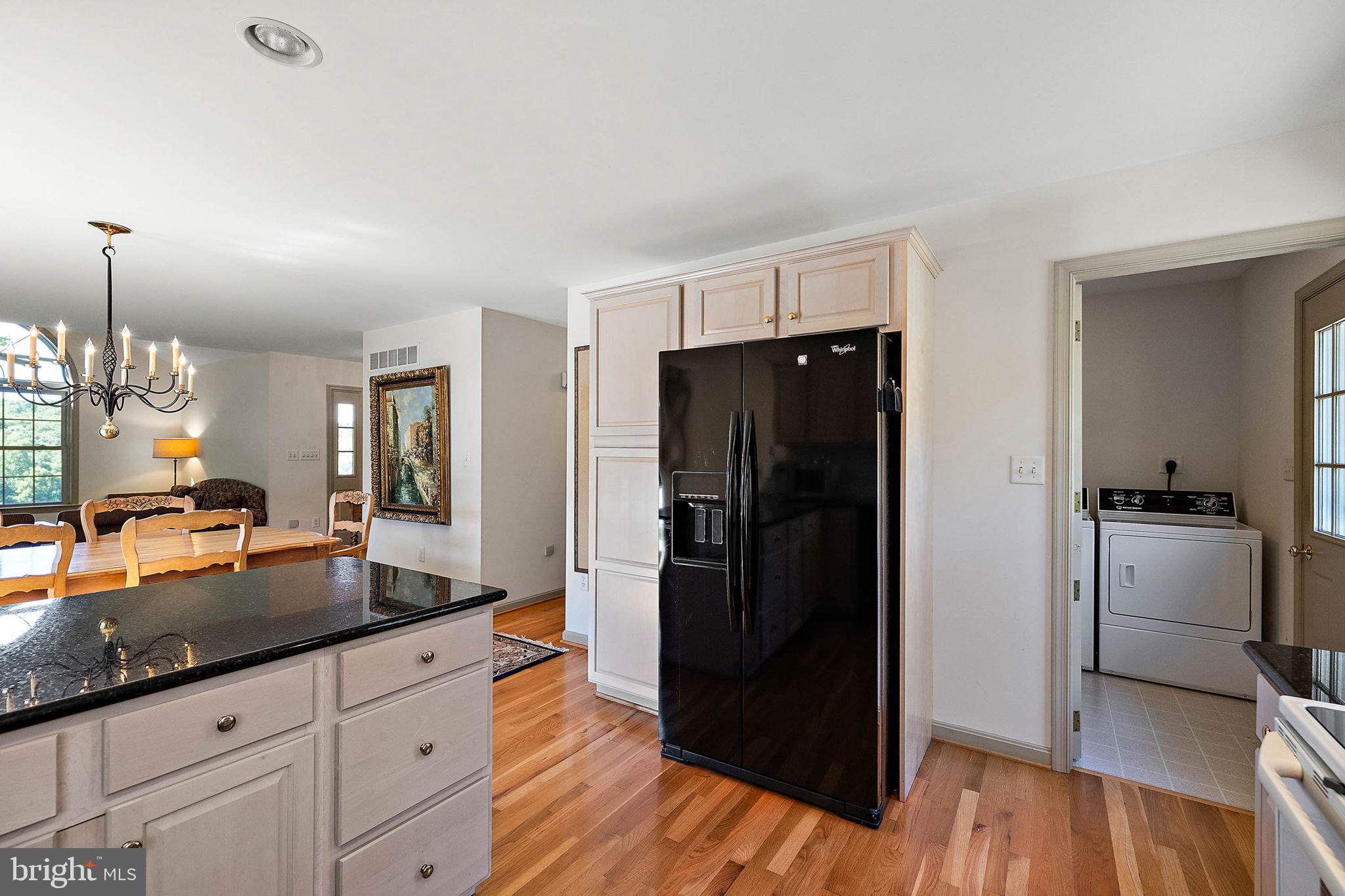 4635 Newark Road Cochranville, PA 19330 - Photo 65 of 113 a kitchen with granite countertop a refrigerator and a sink