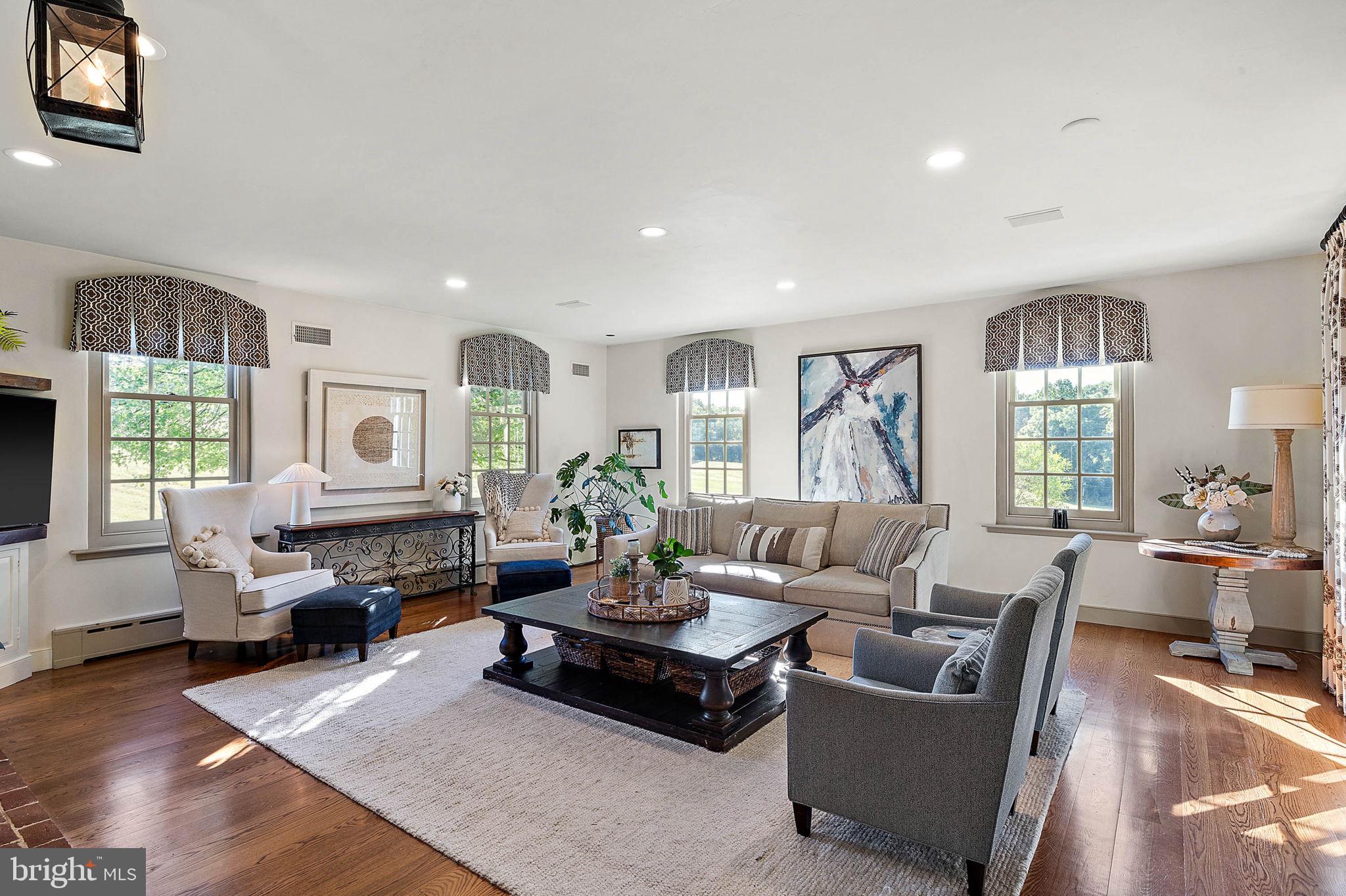 4635 Newark Road Cochranville, PA 19330 - Photo 9 of 113 a living room with furniture fireplace and a large window