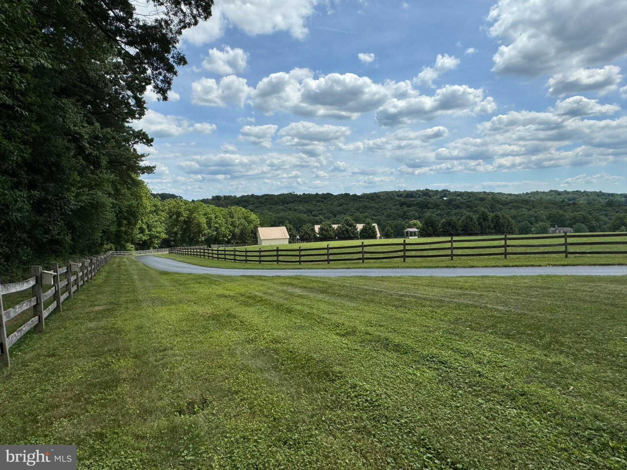 4635 Newark Road Cochranville, PA 19330 - Photo 98 of 113 a view of a golf course with a lake