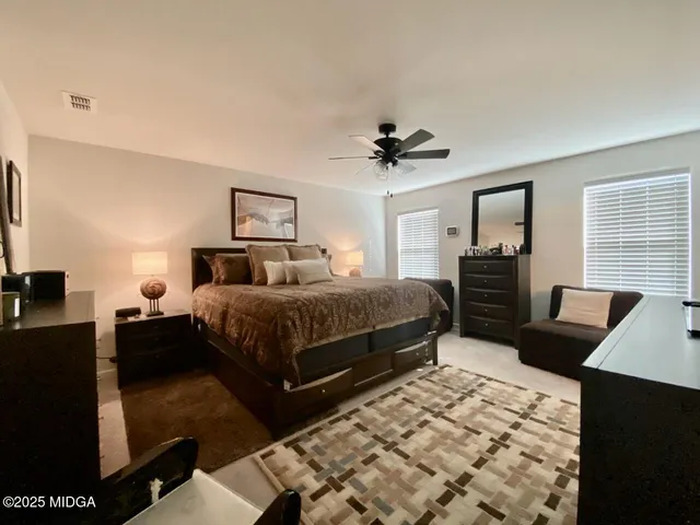 a bedroom with a bed and a couch