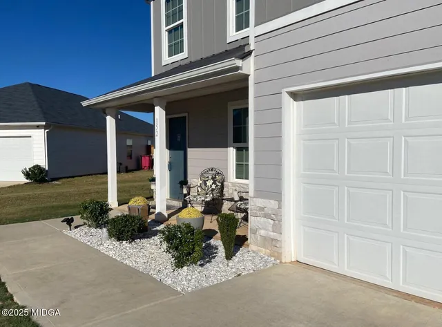 front view of a house with a patio