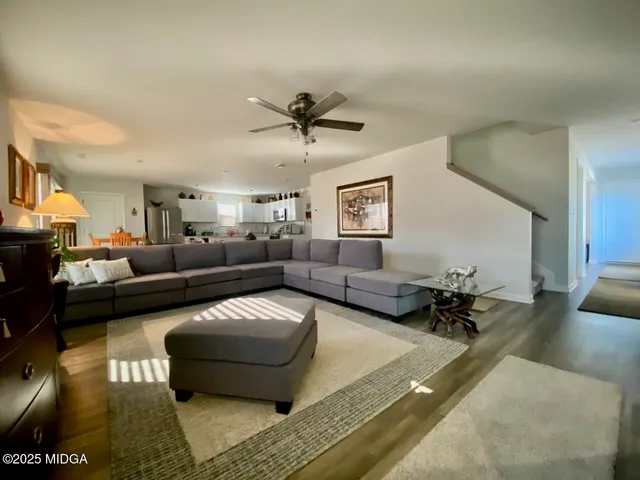 a living room with furniture and a glass table
