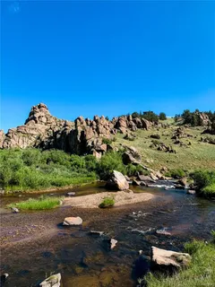 a view of a street with a yard