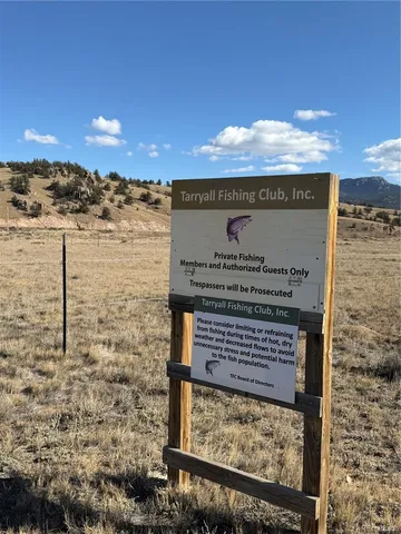 a view of a backyard with sitting area