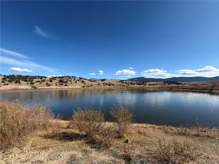a view of lake with sunset
