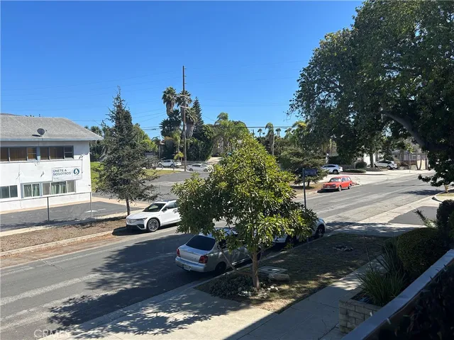 a view of a street with cars