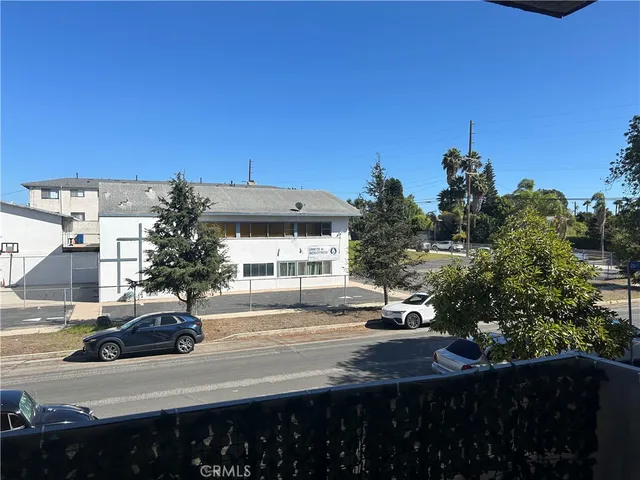 a view of a water with palm trees