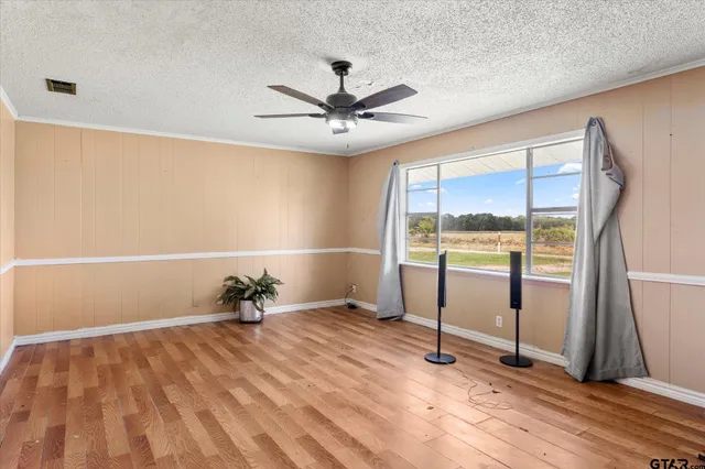 a kitchen with a stove a refrigerator and cabinets