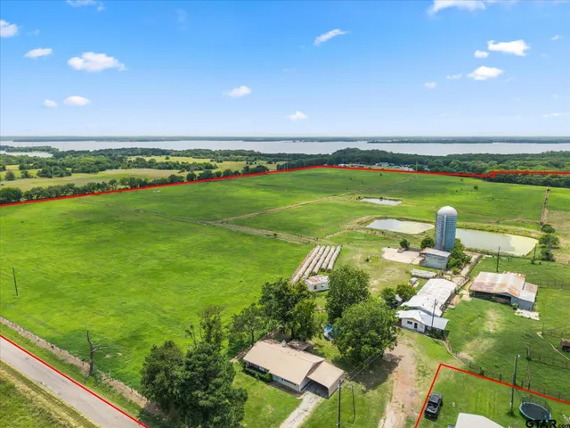 a view of a golf course with a lake view