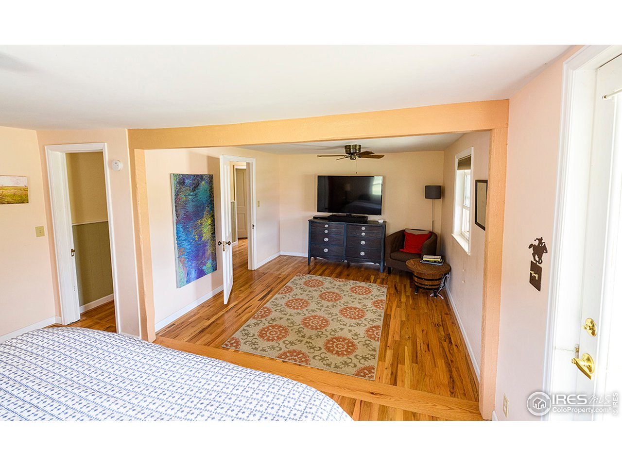 222 Boxer Ranch Road Livermore, CO 80536 - Photo 12 of 28 a living room with furniture and a flat screen tv