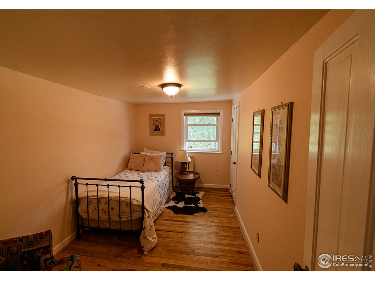 222 Boxer Ranch Road Livermore, CO 80536 - Photo 14 of 28 a room with furniture window and wooden floor