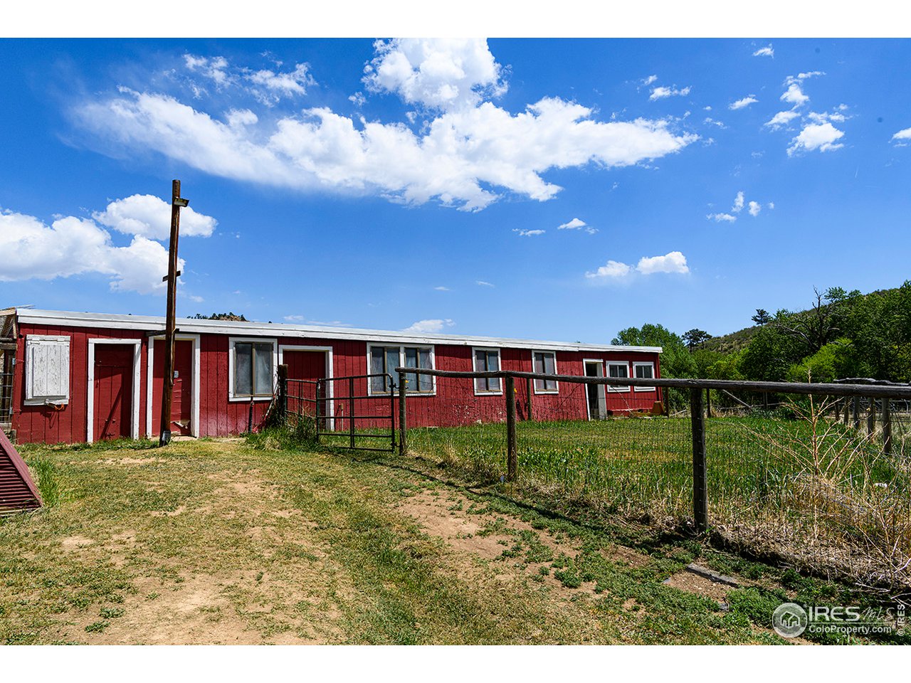 222 Boxer Ranch Road Livermore, CO 80536 - Photo 26 of 28 a view of a house with a backyard