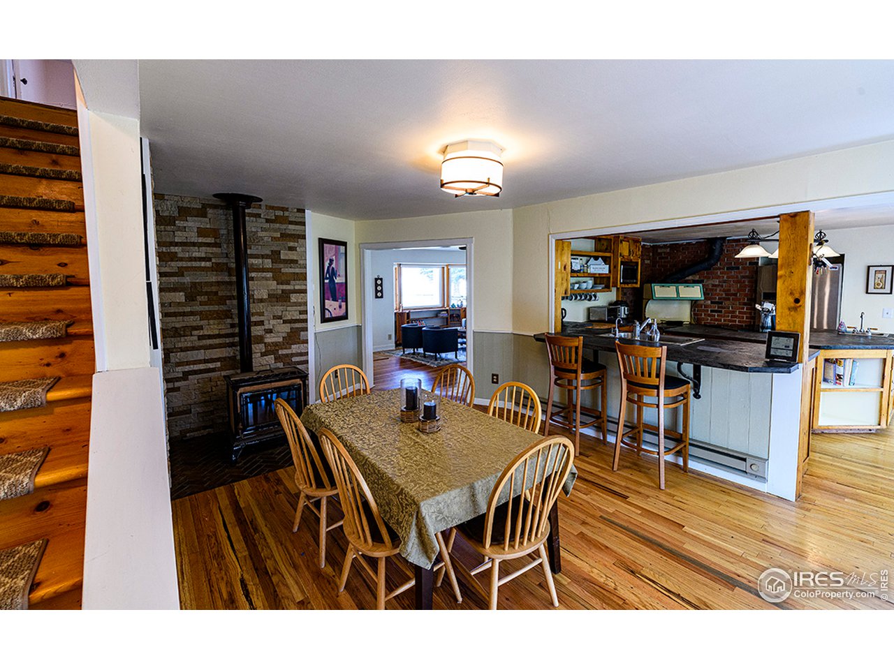 222 Boxer Ranch Road Livermore, CO 80536 - Photo 10 of 28 a dining area with furniture and wooden floor