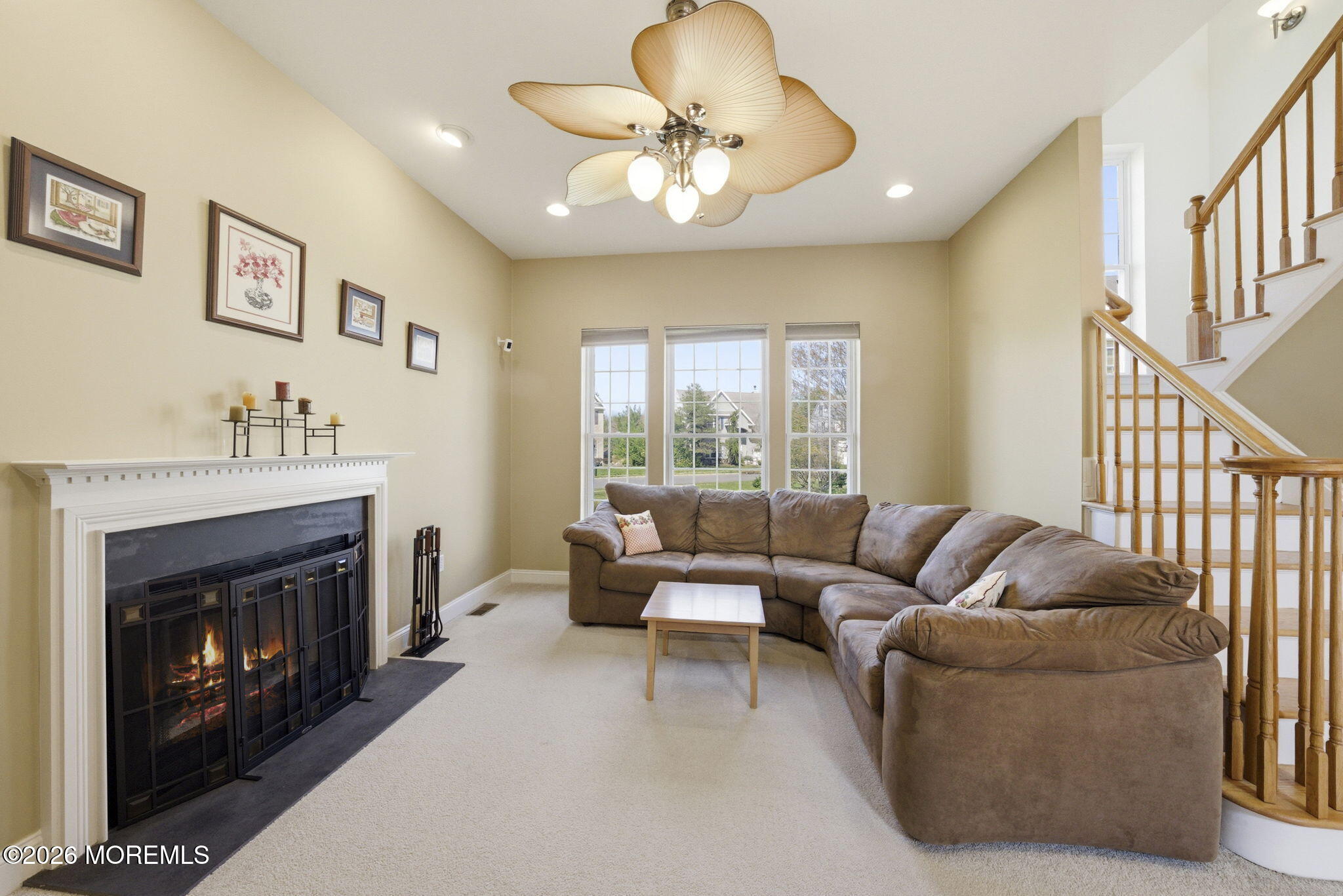 20 Royal Lane Howell, NJ 07731 - Photo 13 of 53 a living room with furniture and a fireplace