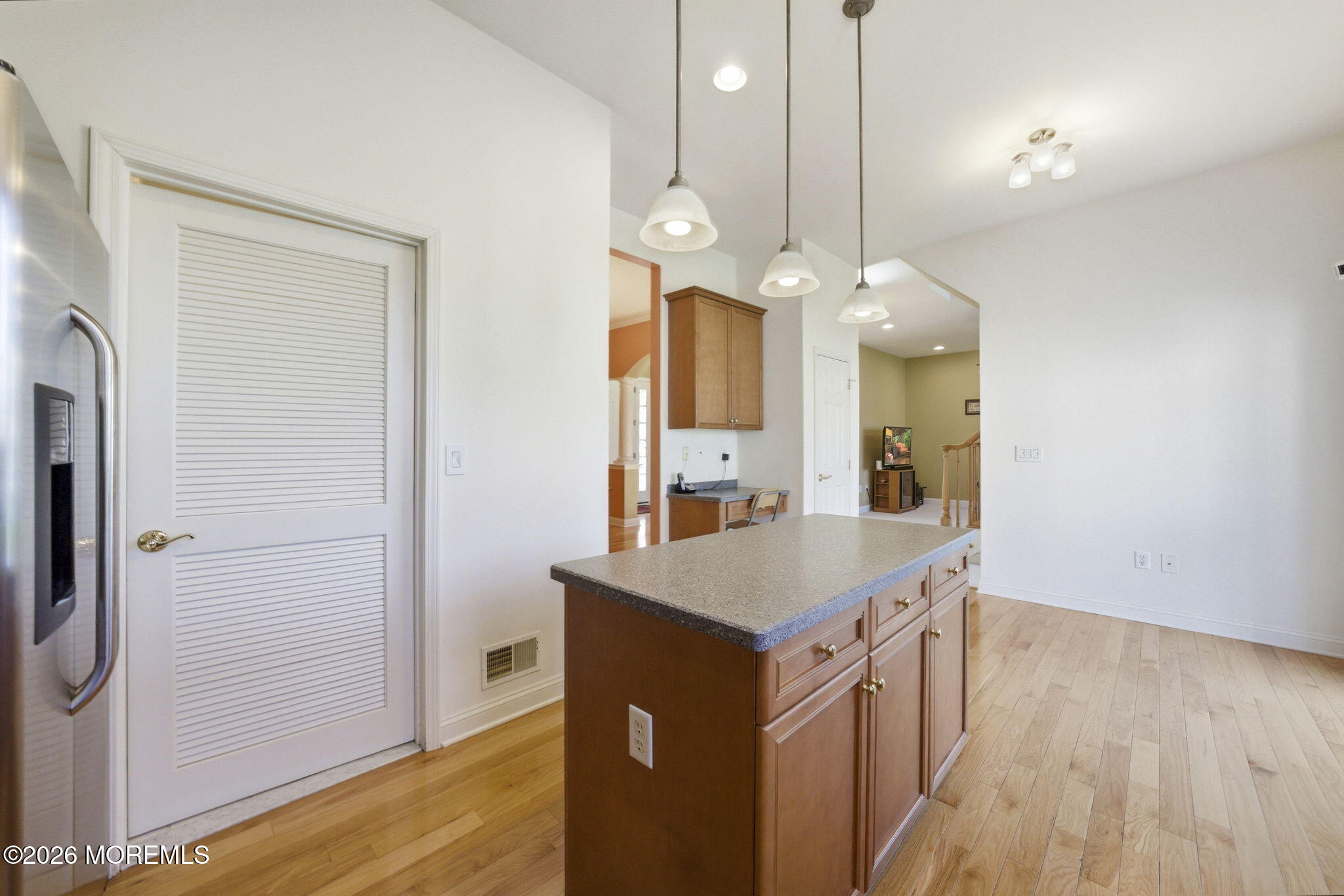 20 Royal Lane Howell, NJ 07731 - Photo 23 of 53 a kitchen with a sink a counter space and a refrigerator