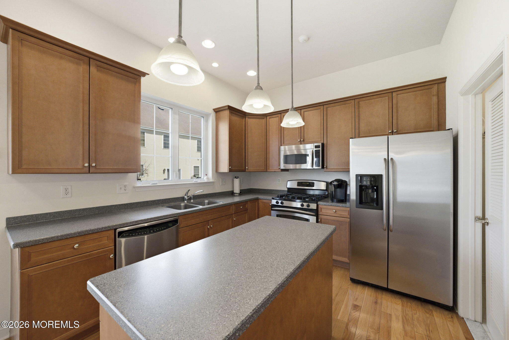 20 Royal Lane Howell, NJ 07731 - Photo 24 of 53 a kitchen with stainless steel appliances granite countertop a sink a stove and refrigerator