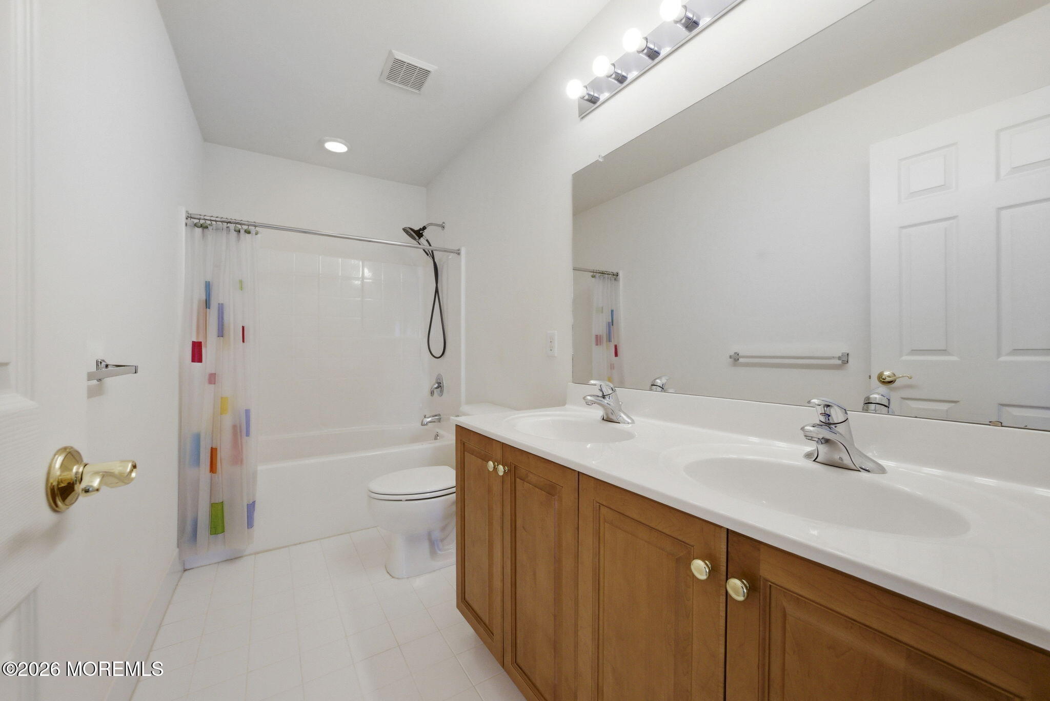 20 Royal Lane Howell, NJ 07731 - Photo 45 of 53 a bathroom with a double vanity sink toilet mirror and shower