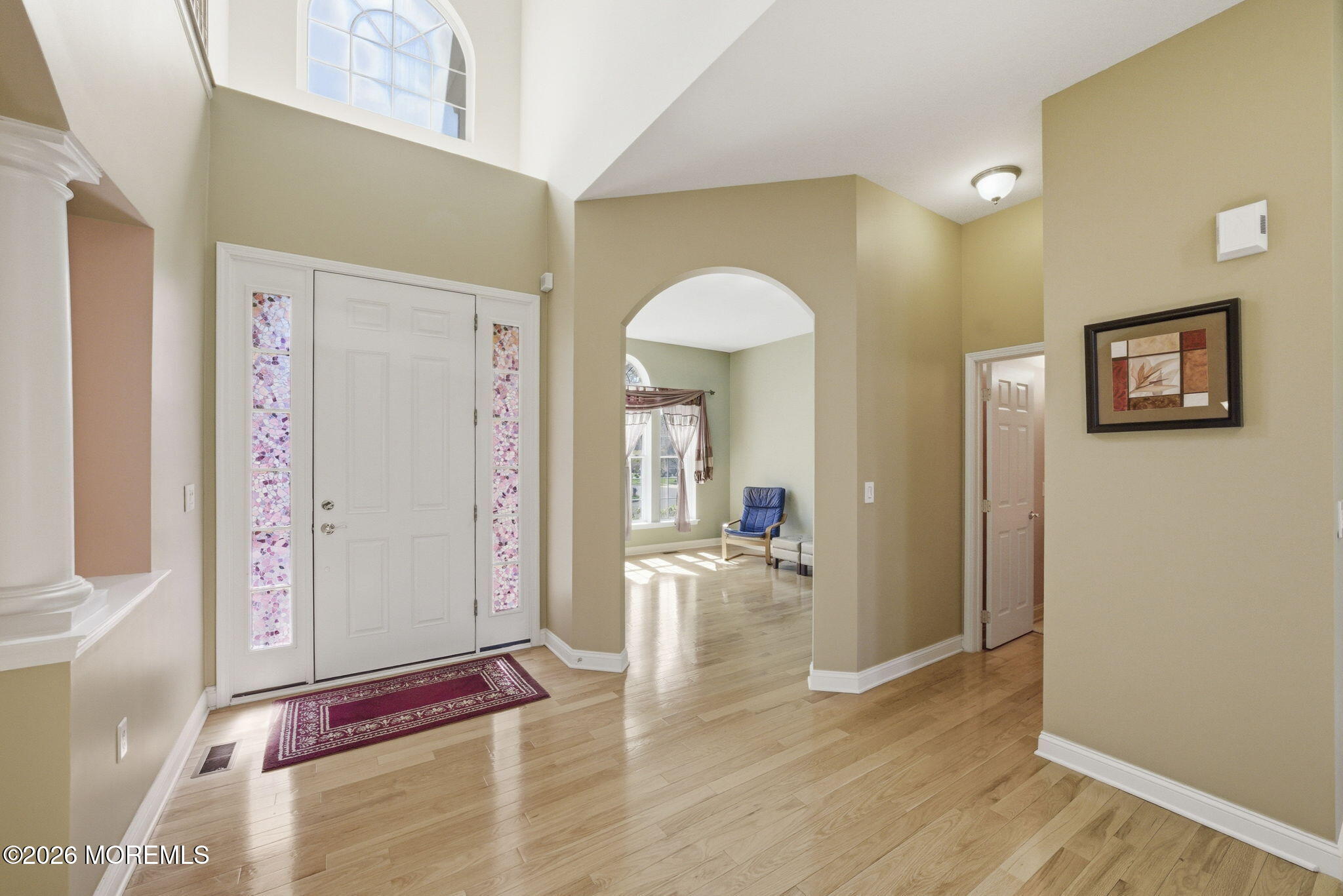 20 Royal Lane Howell, NJ 07731 - Photo 9 of 53 a view of a hallway view with wooden floor and staircase