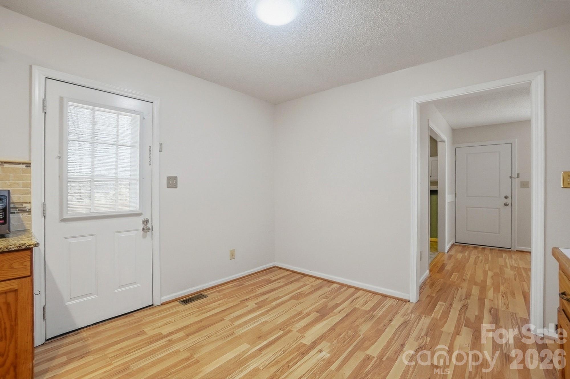 616 Durham Road Stanley, NC 28164 - Photo 13 of 42 wooden floor in an empty room