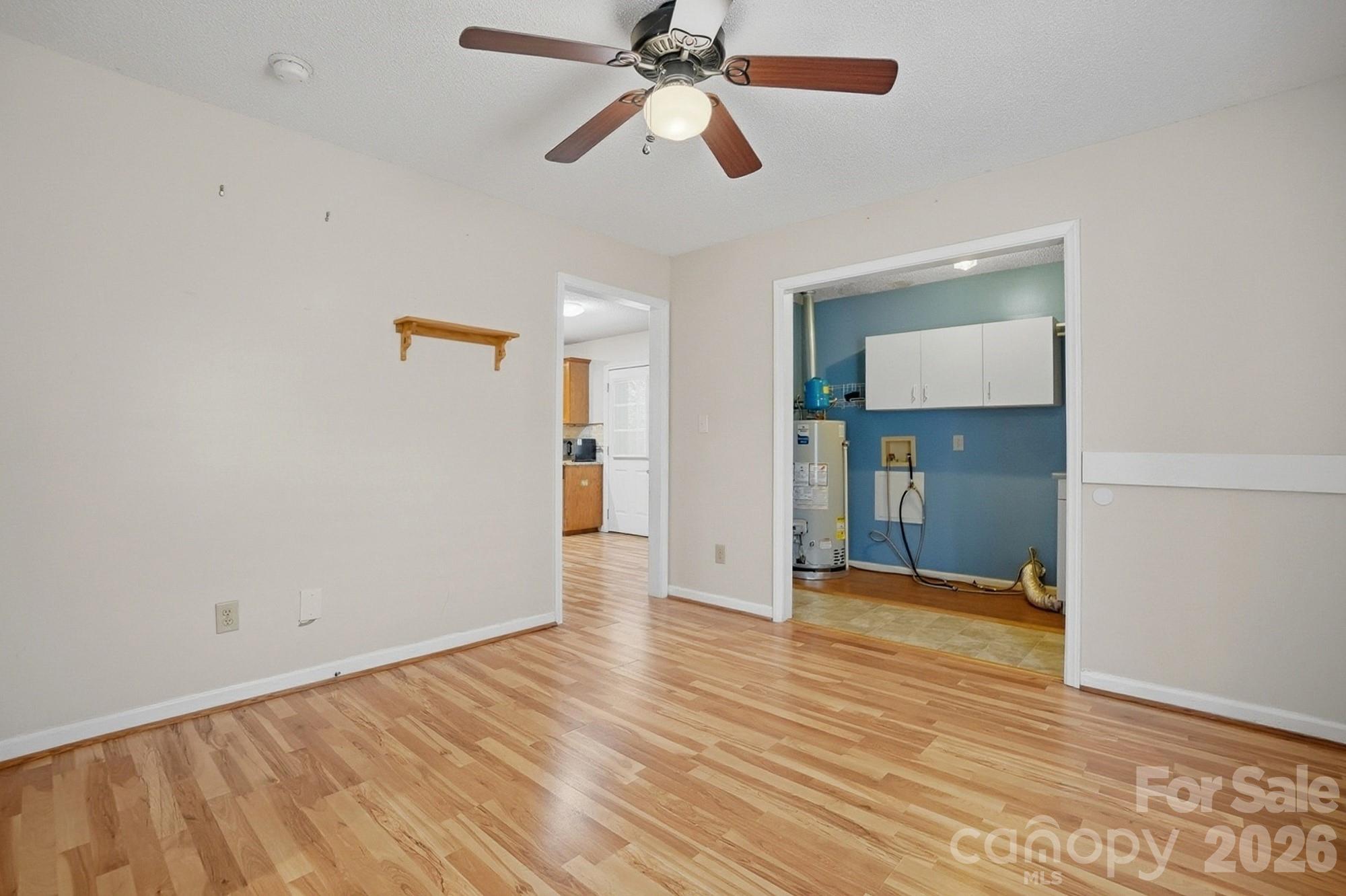 616 Durham Road Stanley, NC 28164 - Photo 18 of 42 a view of an empty room with window and wooden floor