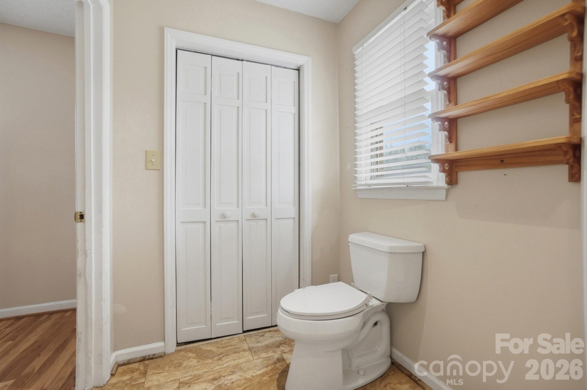 616 Durham Road Stanley, NC 28164 - Photo 21 of 42 a white toilet sitting next to a bathroom sink